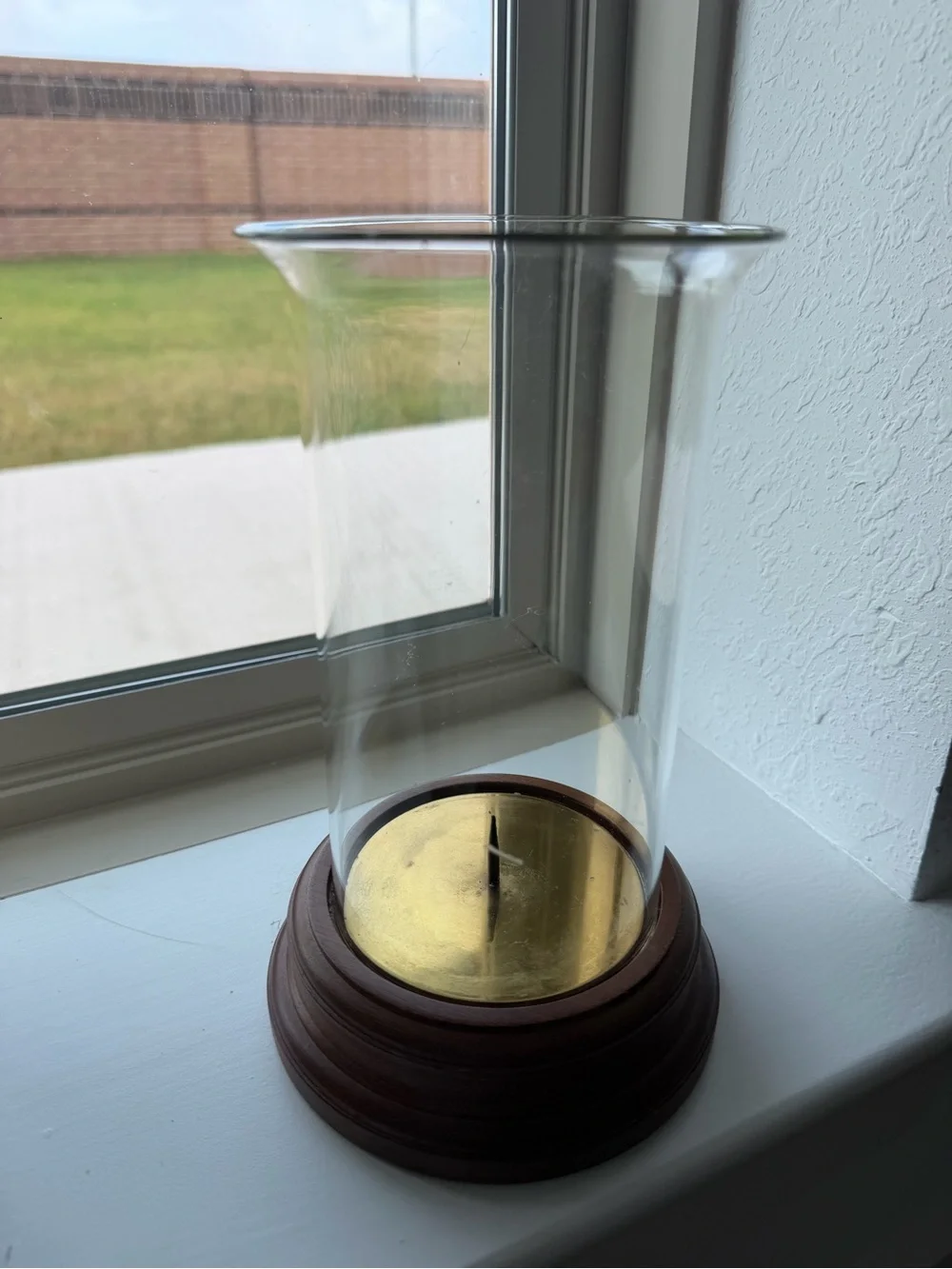 Clear Glass Hurricane Candle Holder with Brown Wood Base and brass Accent